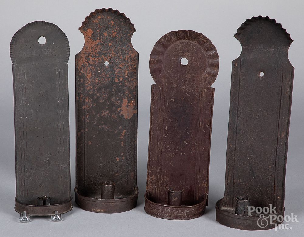 Appraisal: Four tin sconces th c Four tin sconces th c