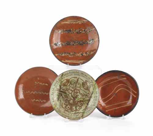 Appraisal: Three slip decorated redware plates th c together with an