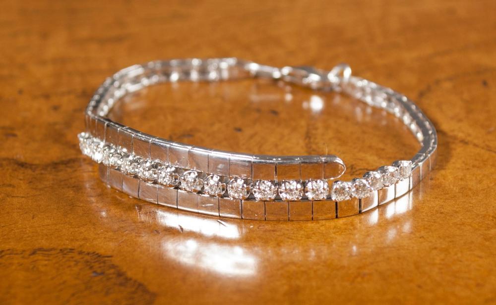 Appraisal: DIAMOND AND FOURTEEN KARAT WHITE GOLD BRACELET set with a