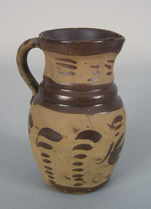 Appraisal: Small tanware pitcher th c with Albany slip decoration h