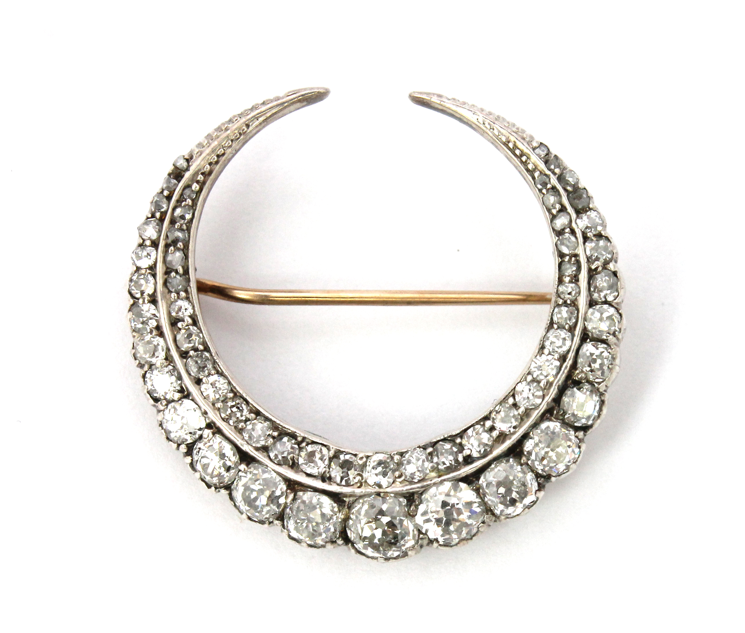 Appraisal: A diamond brooch designed as a crescent mounted with a