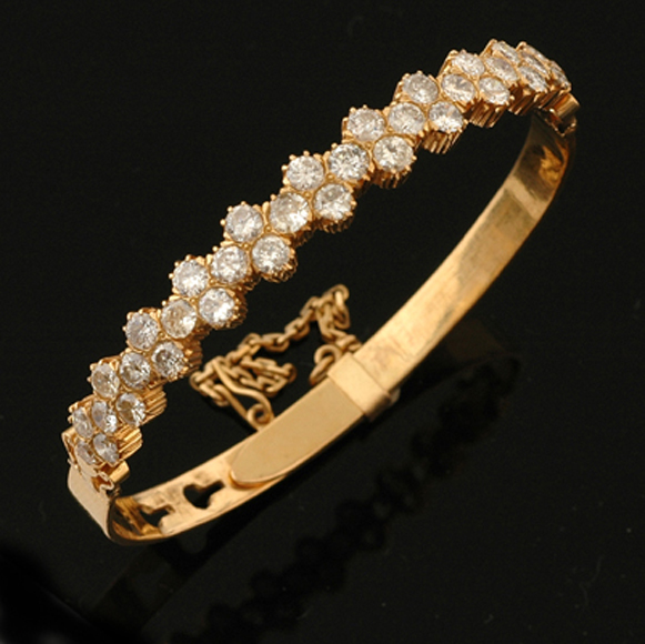 Appraisal: A Straits Chinese diamond bangle The ct gold hinged bangle