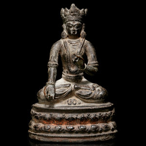 Appraisal: A Sino-Tibetan Bronze Figure of a Seated Crowned Buddha TH