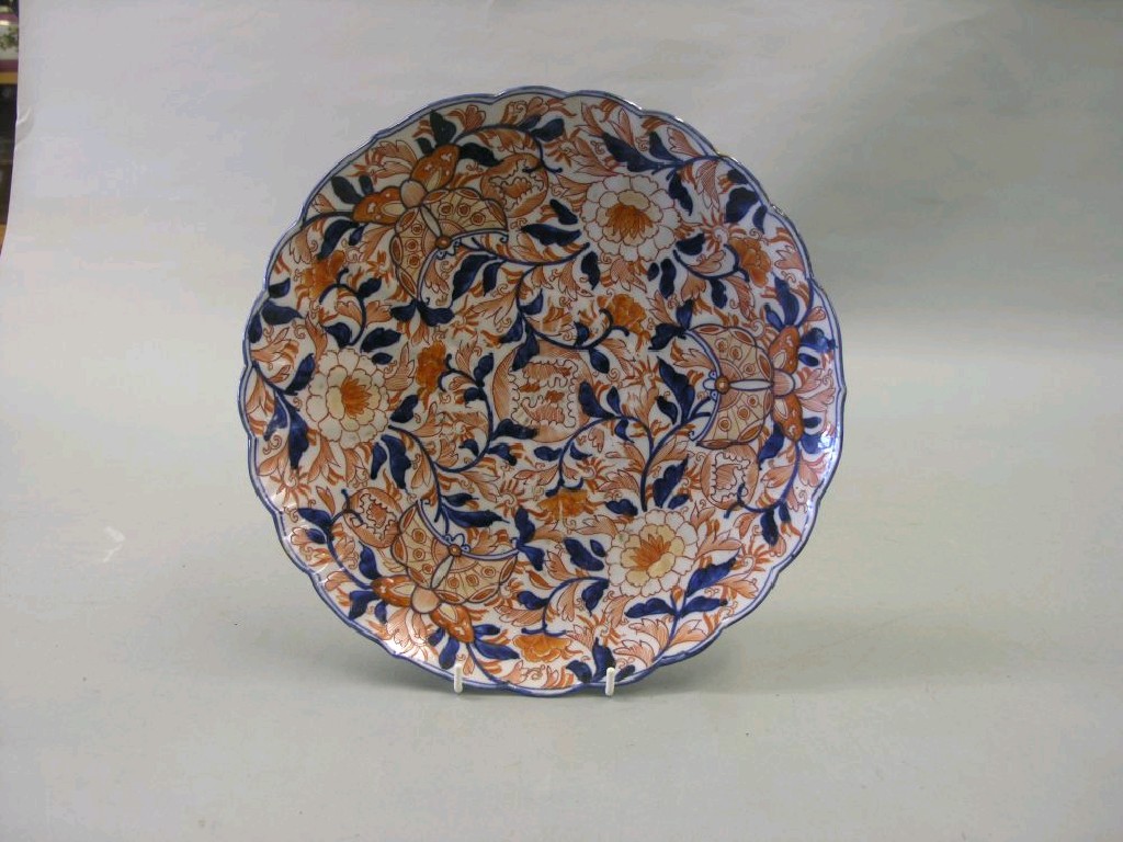 Appraisal: An Imari wall plate with lobed rim painted in traditional