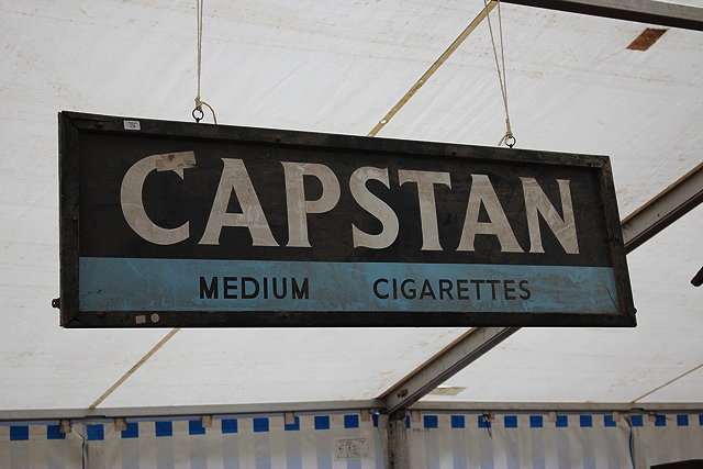 Appraisal: AN OLD CAPSTAN MEDIUM CIGARETTES ENAMEL SIGN set within a