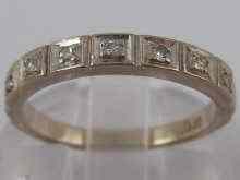 Appraisal: A white metal tests carat gold diamond half eternity ring