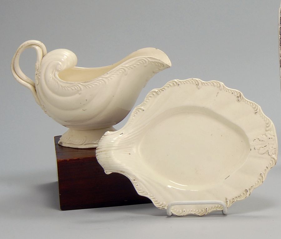 Appraisal: ANTIQUE ENGLISH CREAMWARE SAUCE TUREEN AND UNDERTRAY Probably th CenturyWith