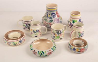 Appraisal: Poole Pottery four floral mugs two floral vases the tallest