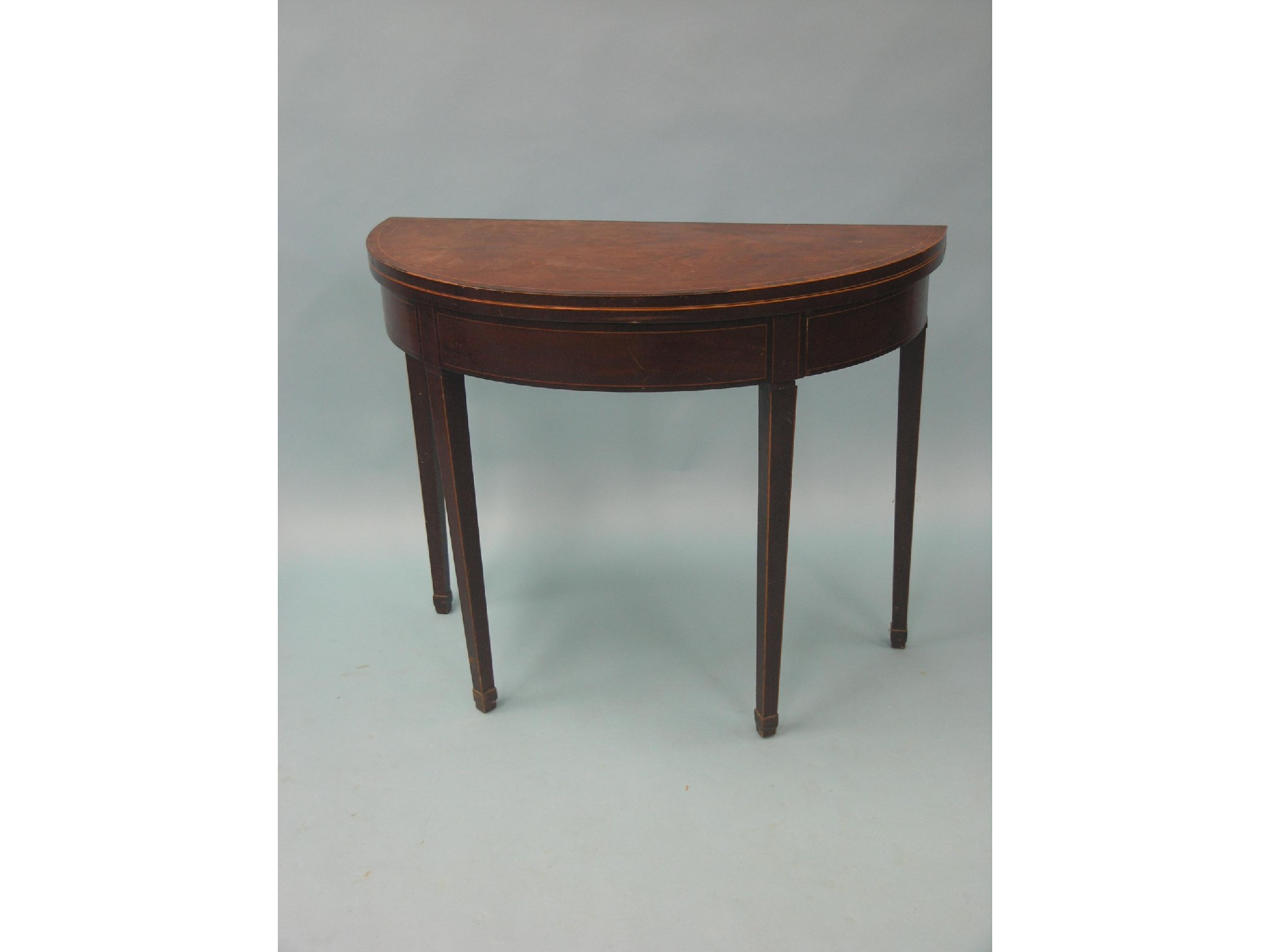 Appraisal: A George III mahogany card table half-round shape with inlaid