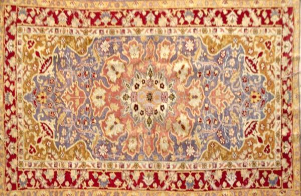 Appraisal: TURKISH CARPET In purple rose and red with central medallion