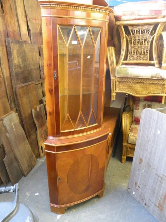 Appraisal: A yew standing corner cabinet