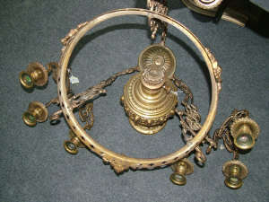 Appraisal: A scroll decorated gilt brass chandelier fitted with nine candle