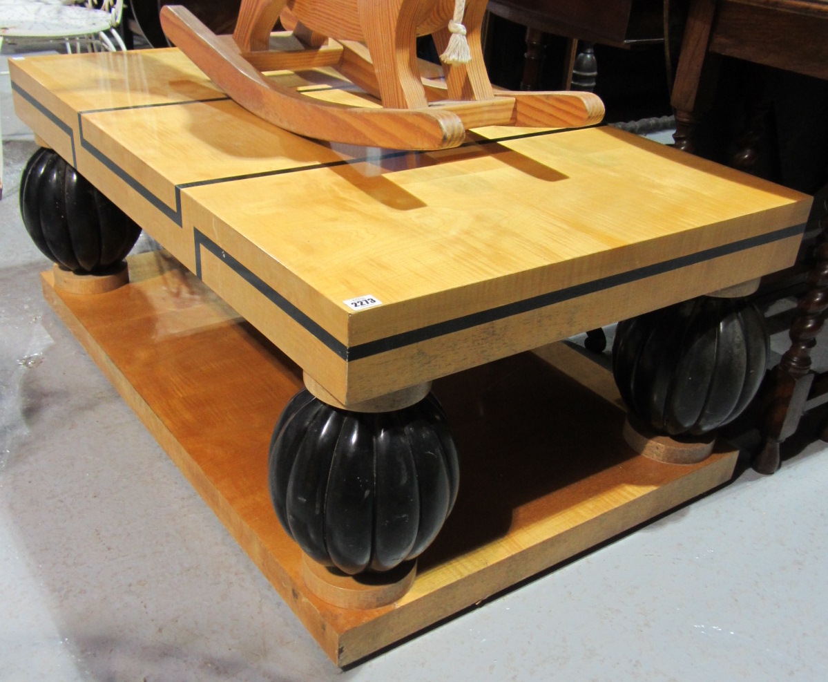 Appraisal: An Art Deco style birch and ebonised rectangular coffee table