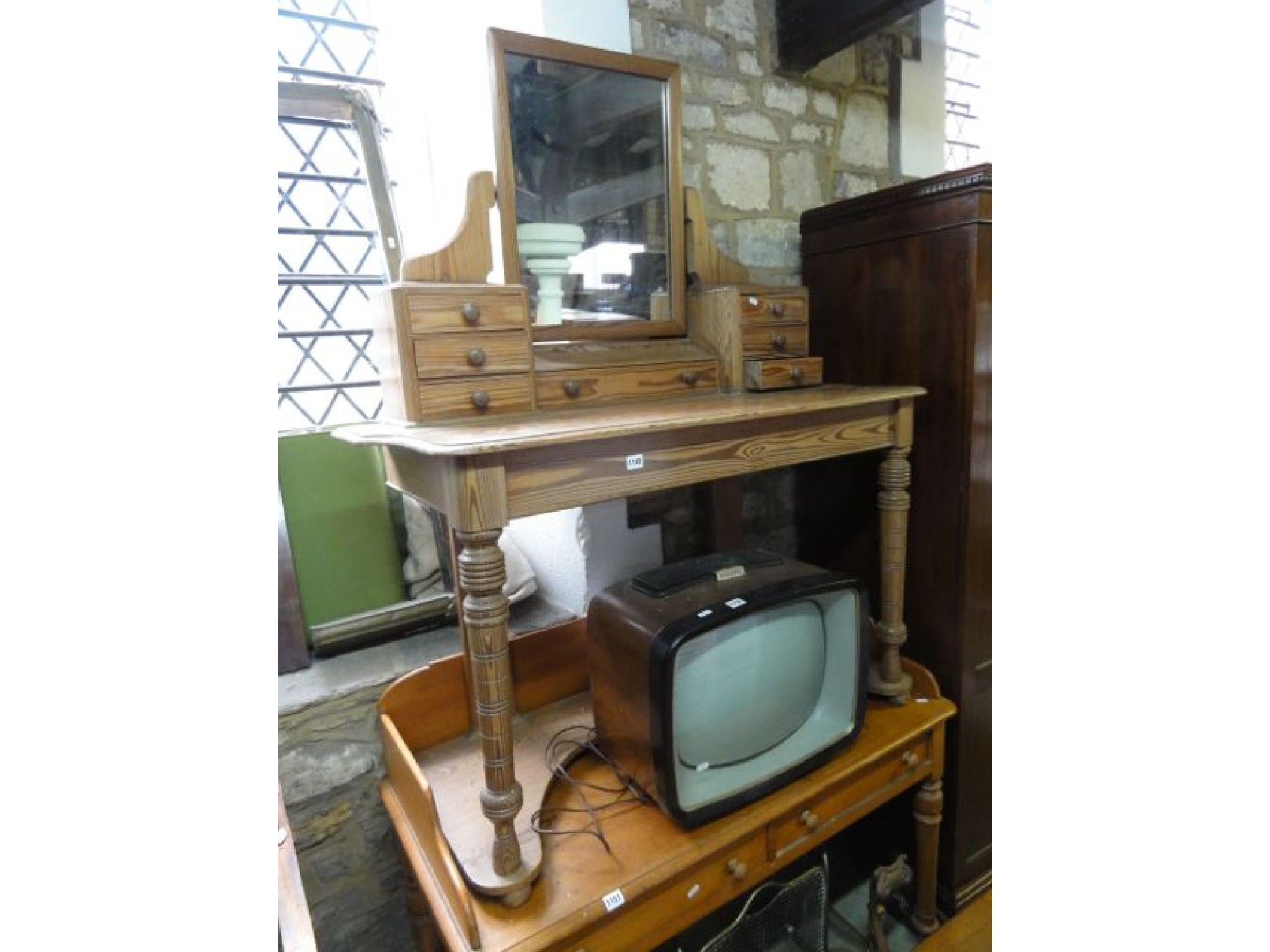 Appraisal: A Victorian pitch pine duchess dressing table the central rectangular