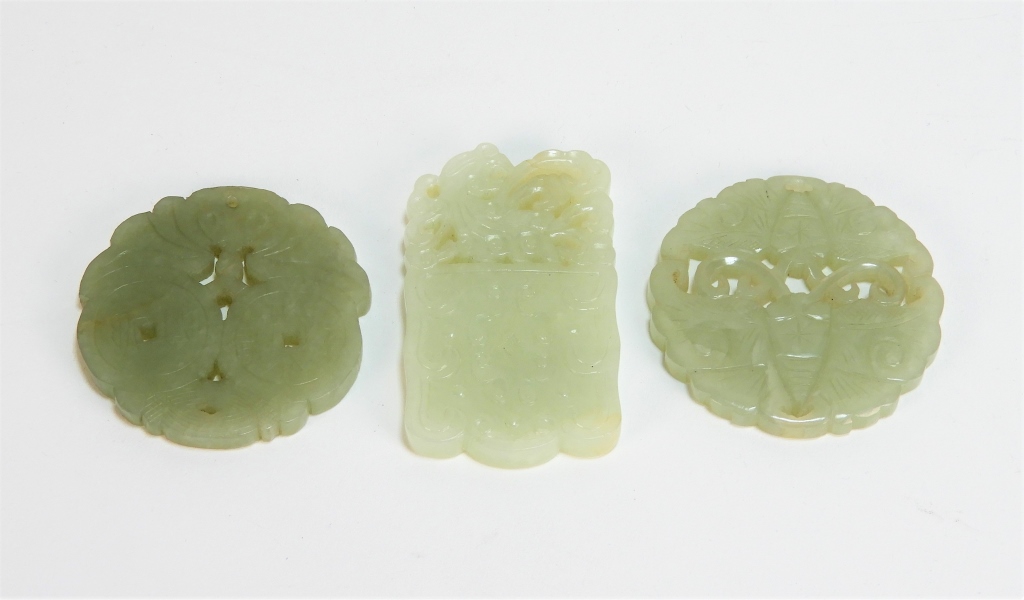 Appraisal: CHINESE CARVED CELADON HARDSTONE AMULETS ChinaQing DynastyIncludes a double sided