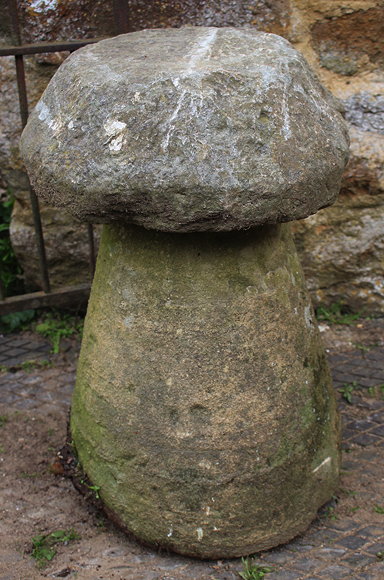 Appraisal: A SMALL CIRCULAR STADDLE STONE with spreading base cm diameter