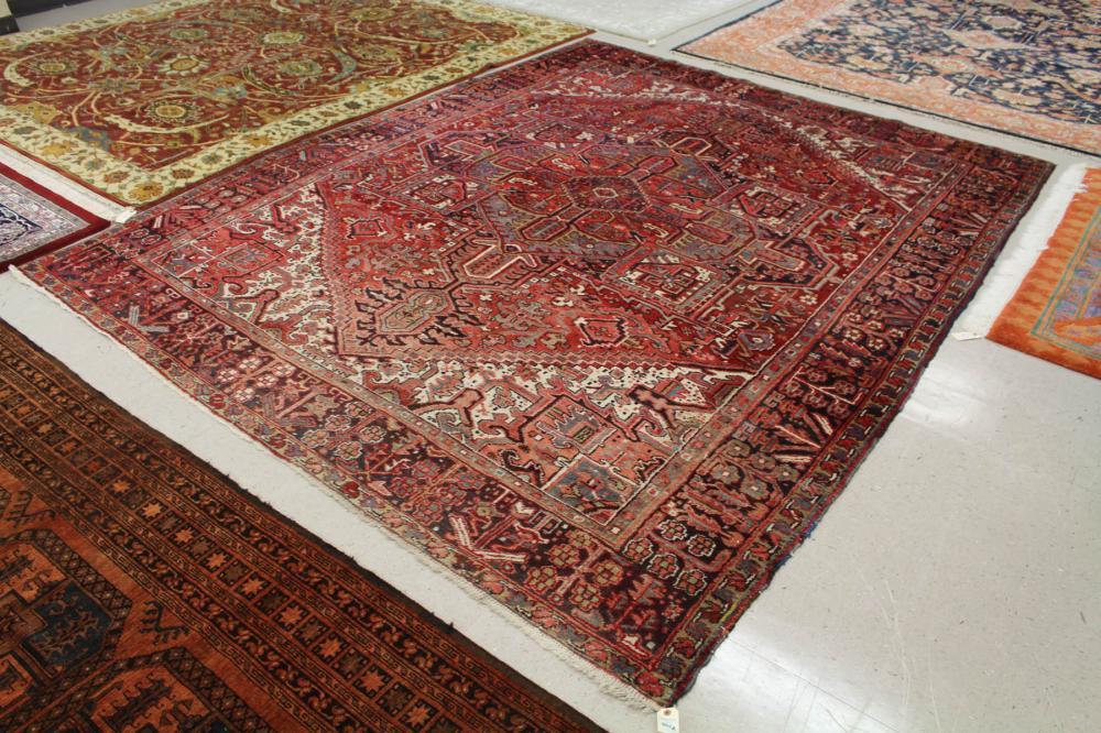 Appraisal: SEMI-ANTIQUE PERSIAN HERIZ CARPET East Azerbaijan Province northwestern Iran geometric