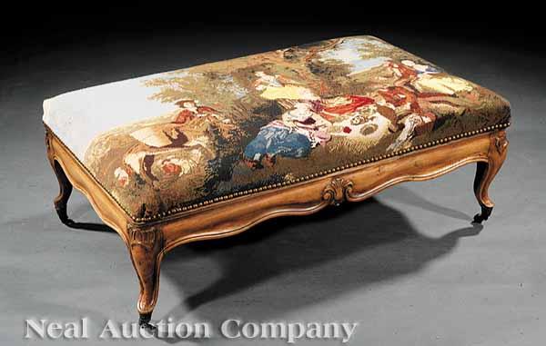 Appraisal: A Louis XV-Style Carved Fruitwood Bench rectangular top with needlepoint