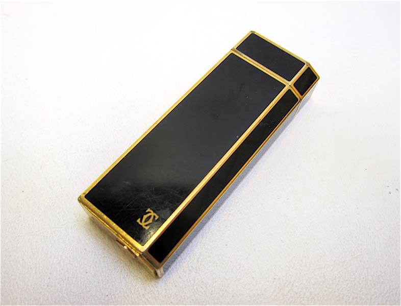 Appraisal: CARTIER PARIS BLACK ENAMEL CIGARETTE LIGHTER Cartier logo on one