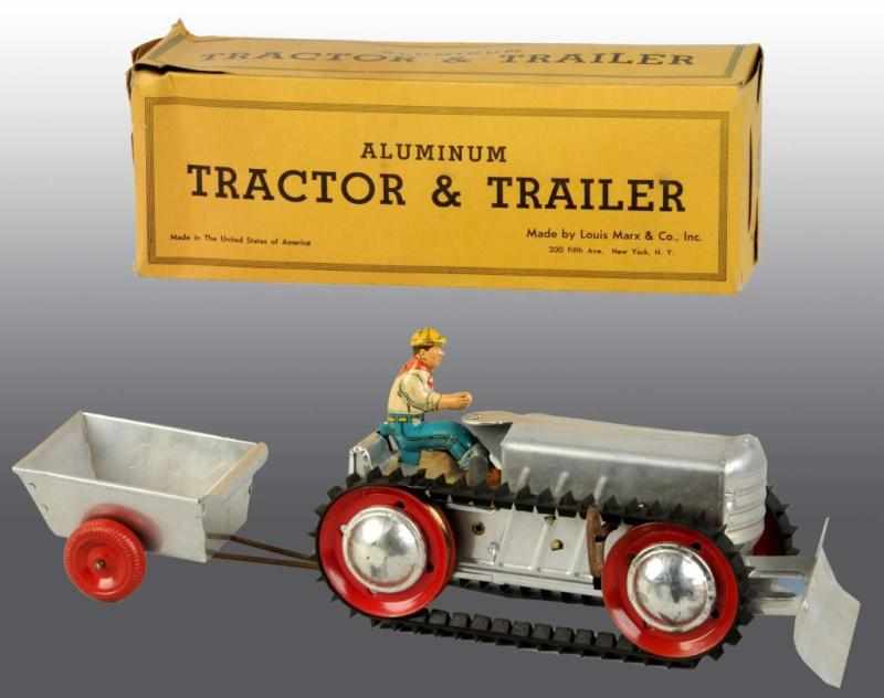 Appraisal: Marx Tin Wind-Up Tractor and Trailor Toy Set Description Includes