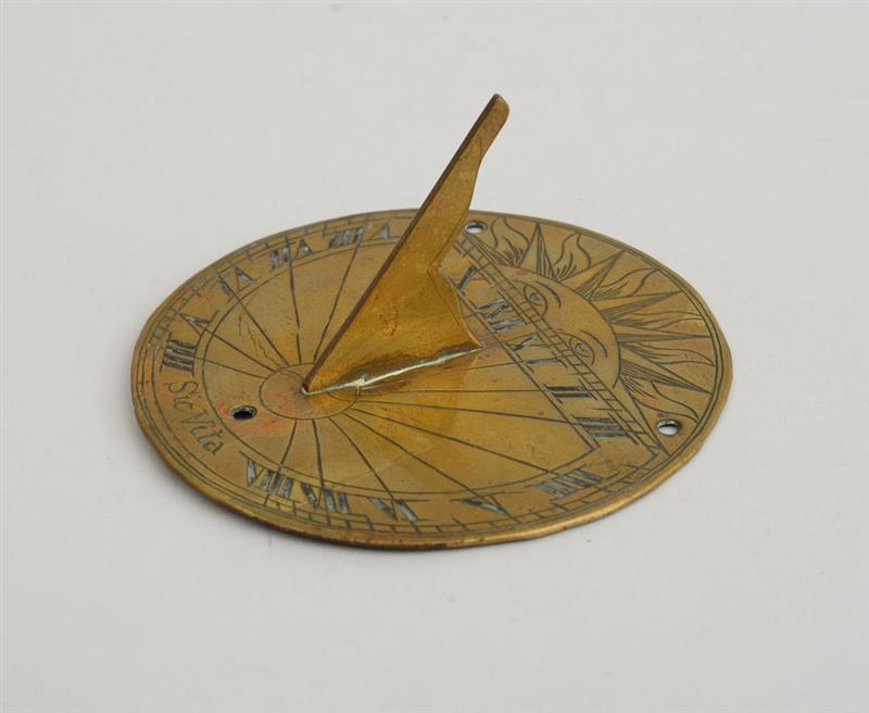 Appraisal: EUROPEAN BRASS SMALL CIRCULAR SUNDIAL Engraved with quarter sun face