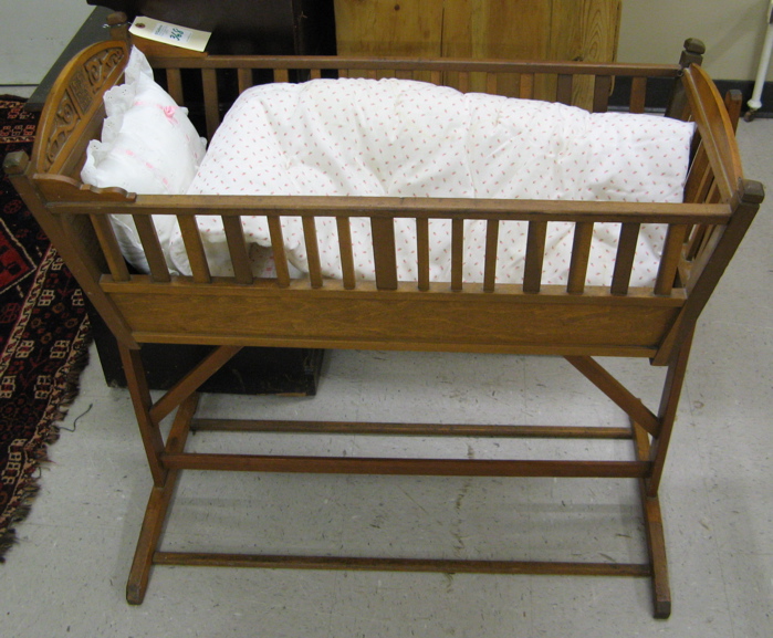 Appraisal: ROCKING INFANT CRADLE ON STAND American dated Nov The rectangular