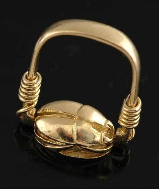 Appraisal: A Scarab ring by Robert Clerc Comprising a swivel form