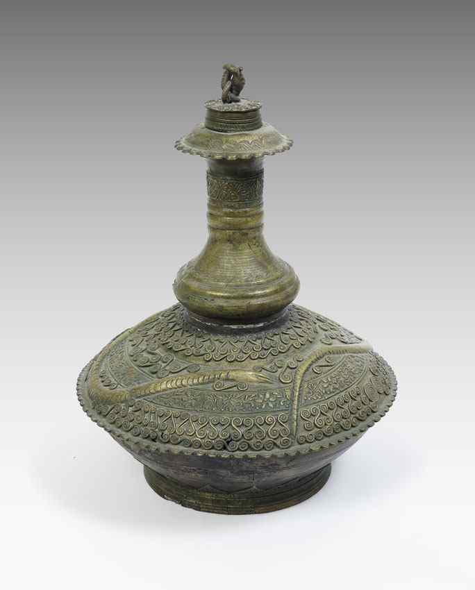 Appraisal: INDIAN BRASS LIDDED VESSEL th C lidded bottle in a