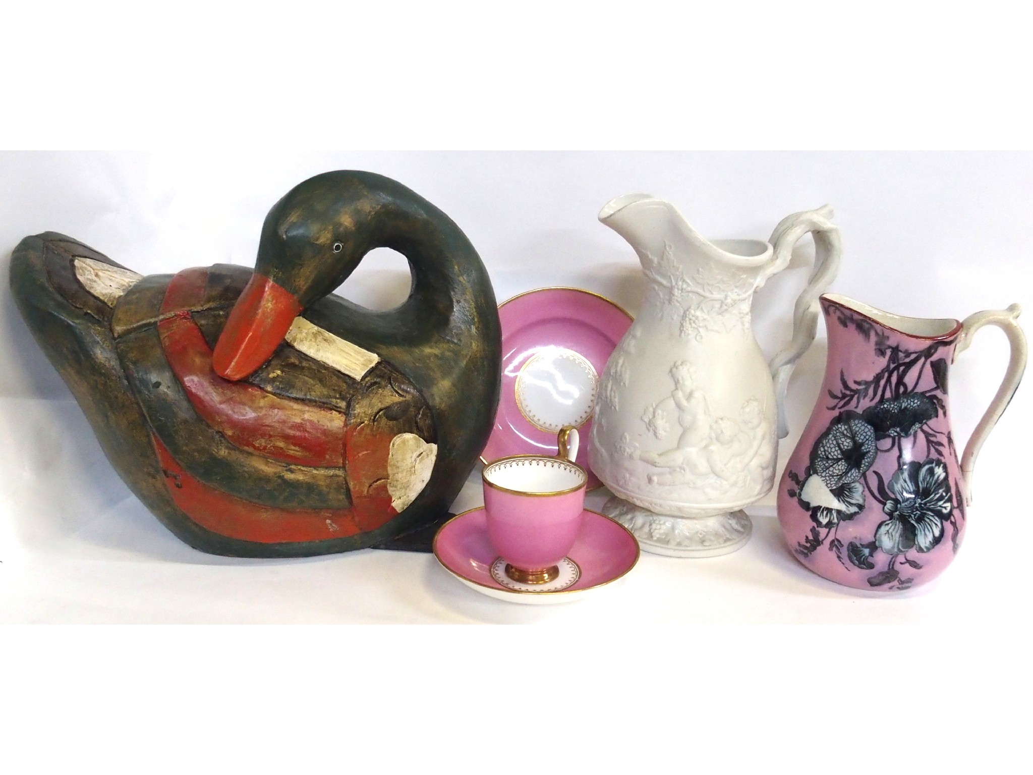 Appraisal: Two Bells Pottery jugs a pink glazed cup saucer and