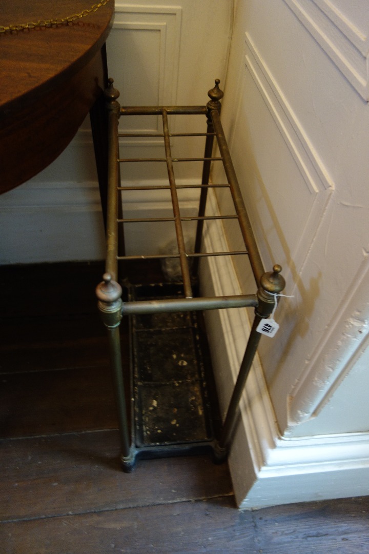 Appraisal: A late Victorian brass twelve division stick stand with cast