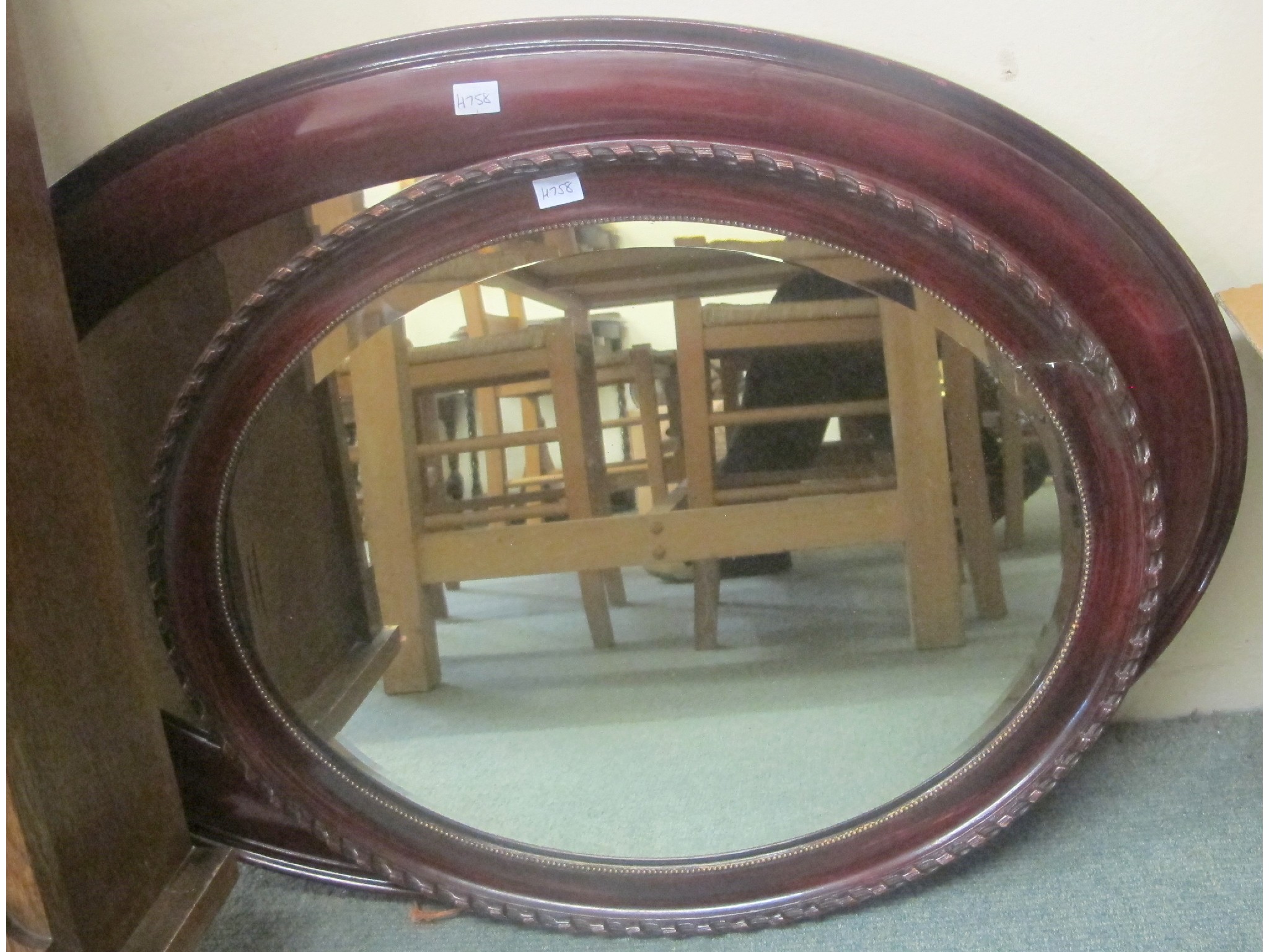 Appraisal: Two mahogany framed oval wall mirrors