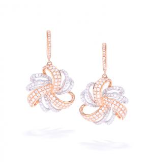 Appraisal: A PAIR OF TWO-TONE DIAMOND EARRINGS Suspended from diamond set