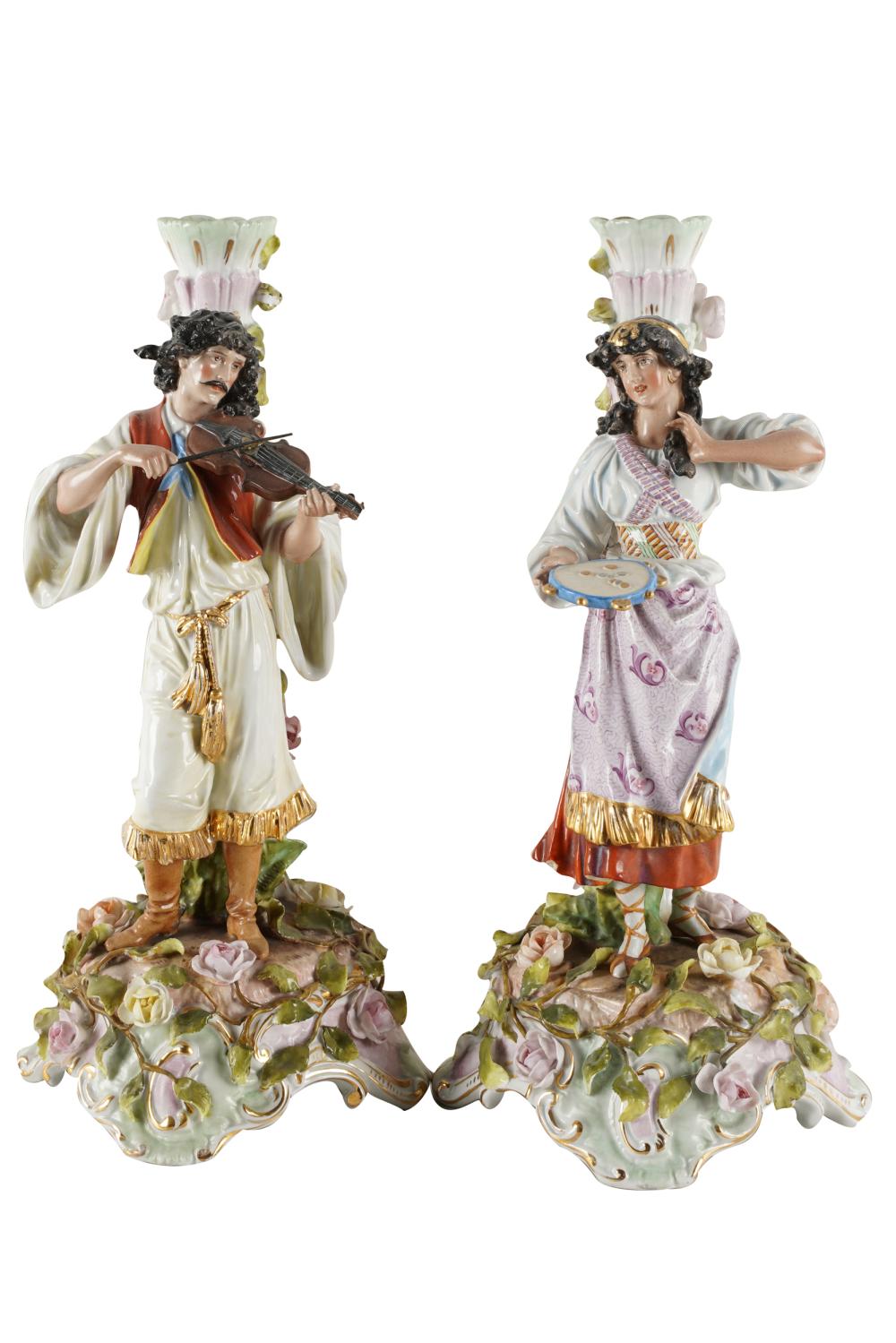 Appraisal: PAIR OF GERMAN PORCELAIN FIGURAL CANDLESTICKSeach with Meissen-style blue crossed