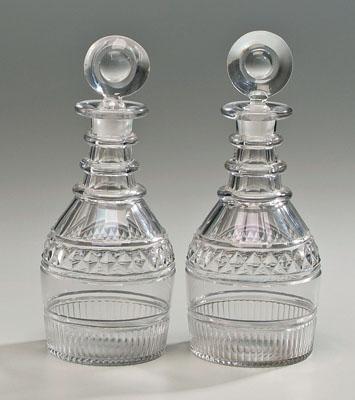 Appraisal: Pair cut crystal decanters circular stoppers above cut glass paneled