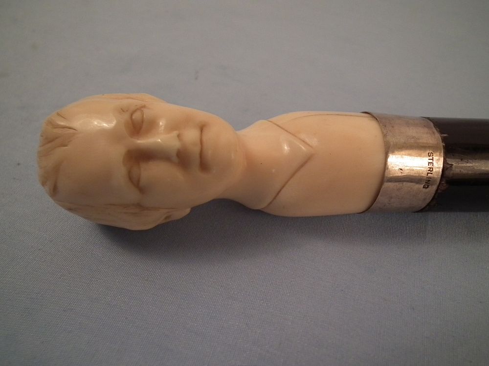 Appraisal: ROBERT BURNS BONE CANE th century finely carved bone handled