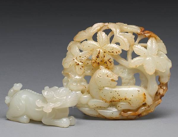 Appraisal: Two jade carvings The first a recumbent unicorn-like beast with