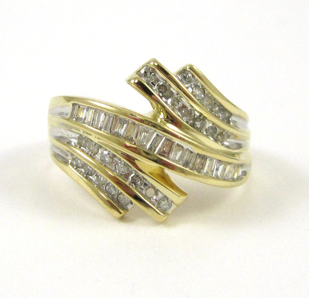 Appraisal: DIAMOND AND TEN KARAT GOLD RING set with round-cut diamonds