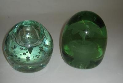 Appraisal: A VICTORIAN GREEN GLASS DUMP with flower pot inclusion high