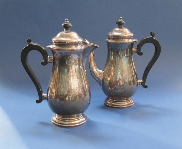 Appraisal: A CAFE AU LAIT SET of baluster form with scroll