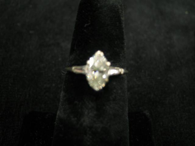 Appraisal: Marquise Diamond Ring carat diamond with carat tapered baquette on