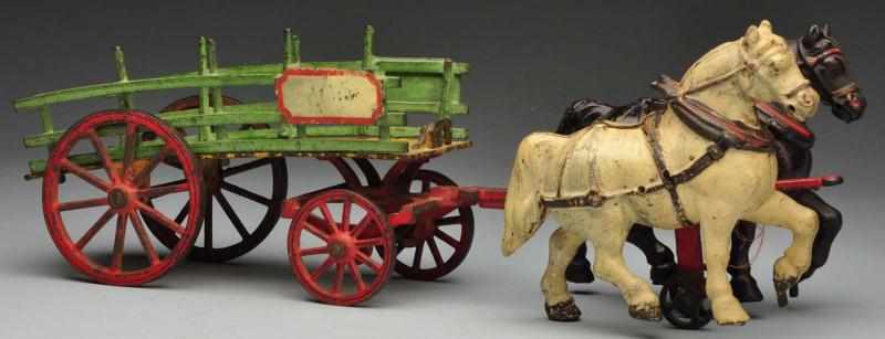 Appraisal: Cast Iron Dray Wagon Horse-Drawn Toy Description American Made by