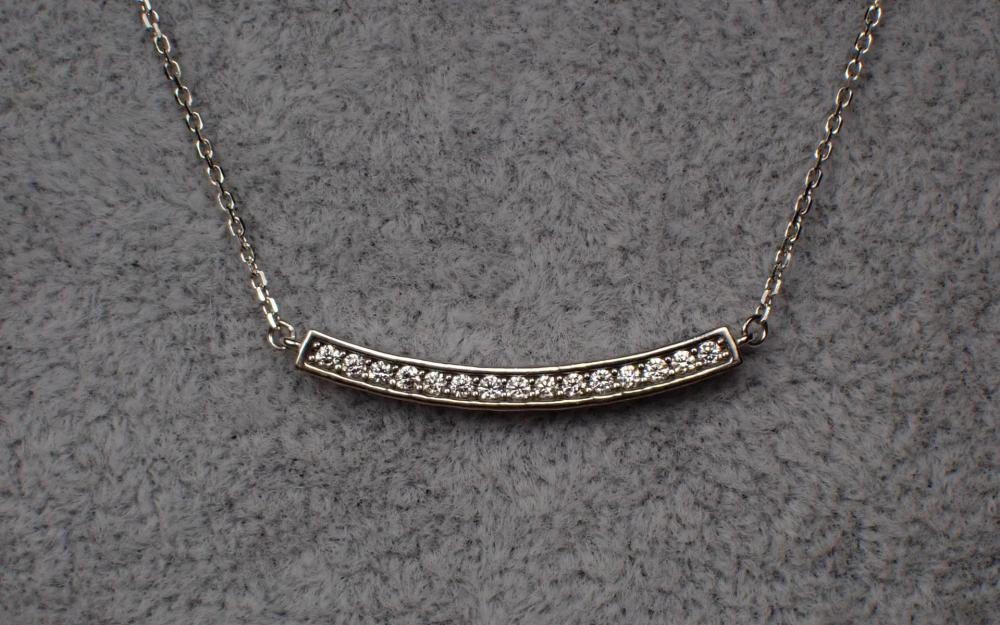 Appraisal: DIAMOND AND FOURTEEN KARAT WHITE GOLD NECKLACE with a length