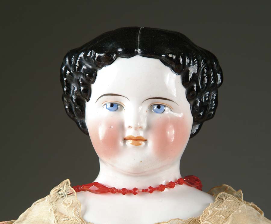 Appraisal: CHINA HEAD DOLL Center part curls on either side of