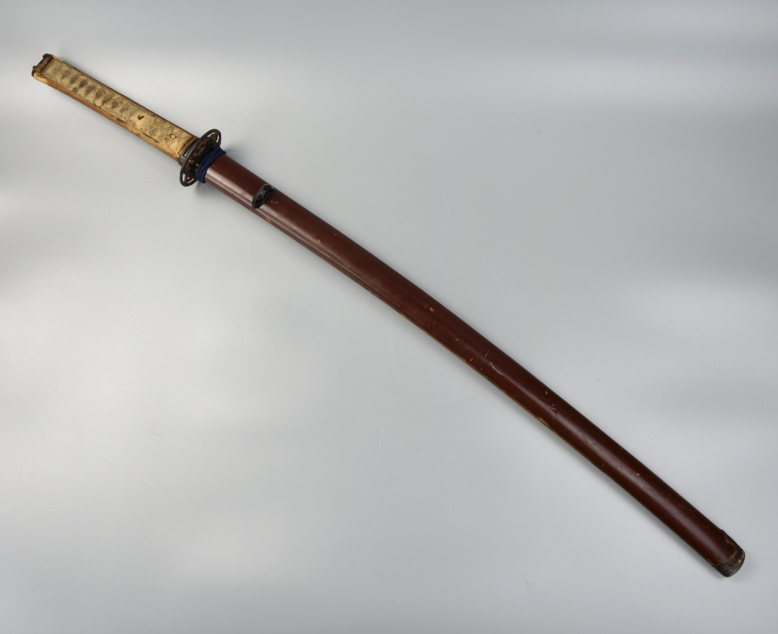 Appraisal: A JAPANESE SWORD WITH LACQUER WOOD HANDLE Japanese samurai sword