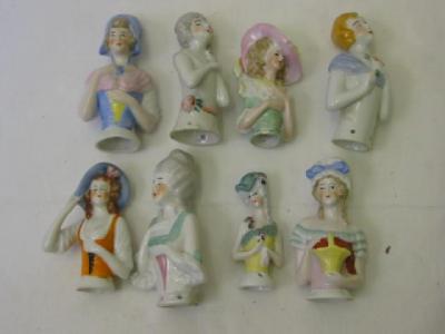 Appraisal: Eight porcelain pin cushion dolls one modelled wearing a mob