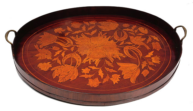 Appraisal: AN ANTIQUE MAHOGANY OVAL TRAY with decorative floral and exotic