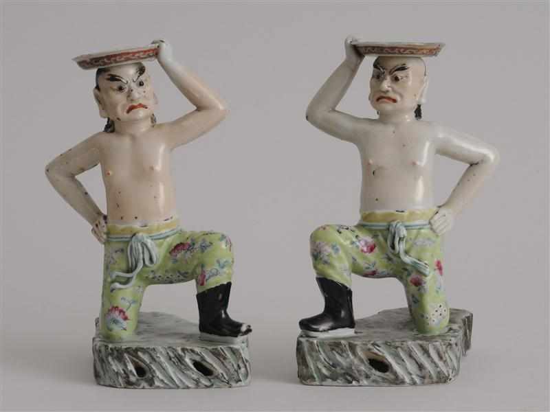 Appraisal: PAIR OF CHINESE FAMILLE ROSE PORCELAIN FIGURAL CANDLESTICKS Each a