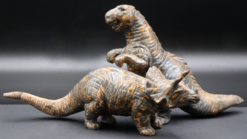 Appraisal: CARVED JASPER SPECIMENS OF DINOSAURS Includes a carved jasper tyrannosaurus