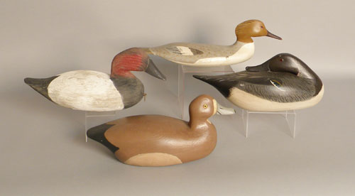 Appraisal: Group of four decoys late th c canvasback stamped Eddie