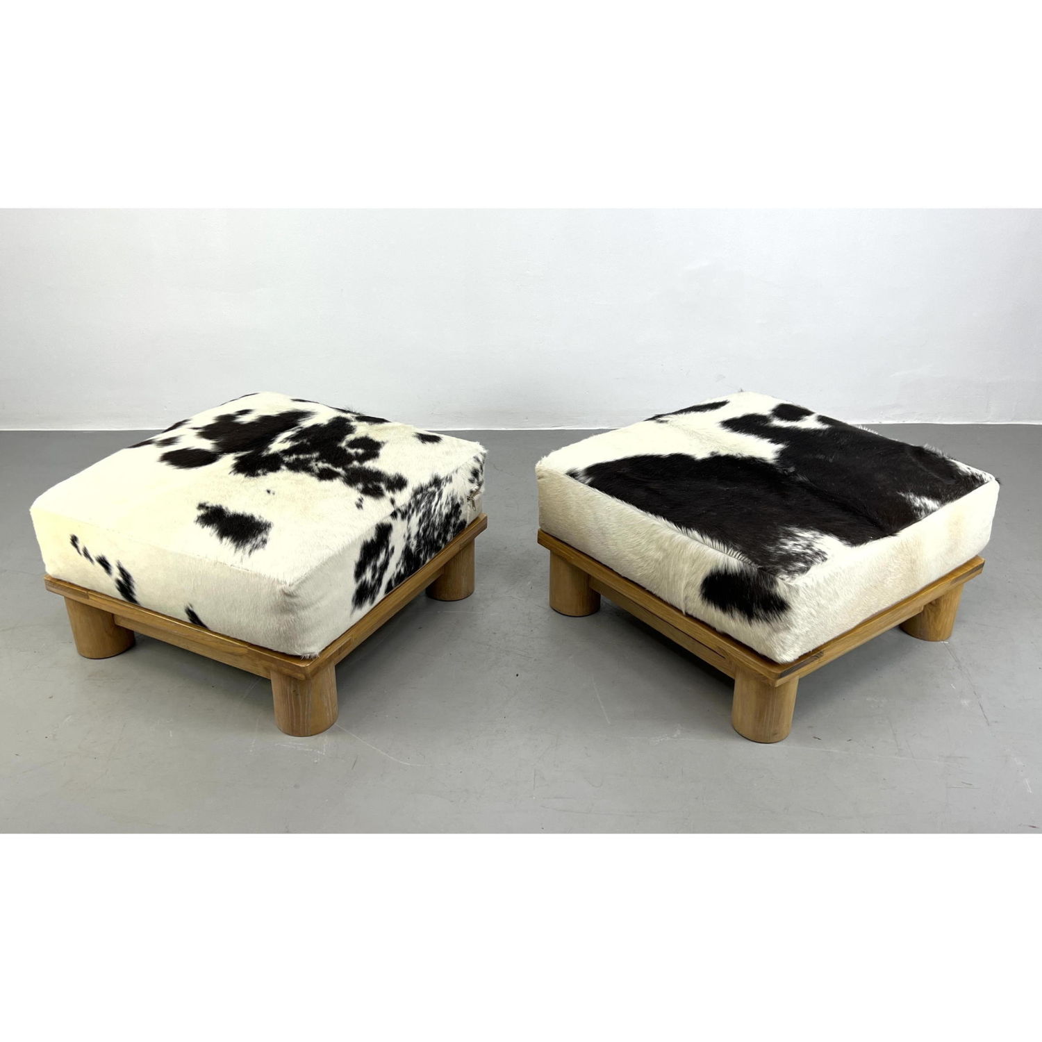 Appraisal: Pr Cow Hide Designer Ottoman Foot Stools Karl Springer Style